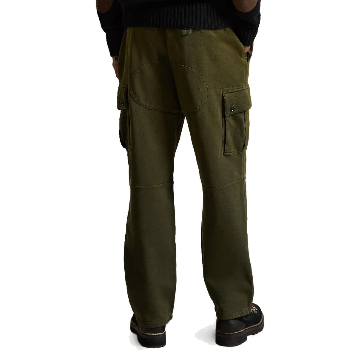 A person shown from the back wearing olive green cargo pants, a black ribbed sweater, and black shoes against a plain white background.