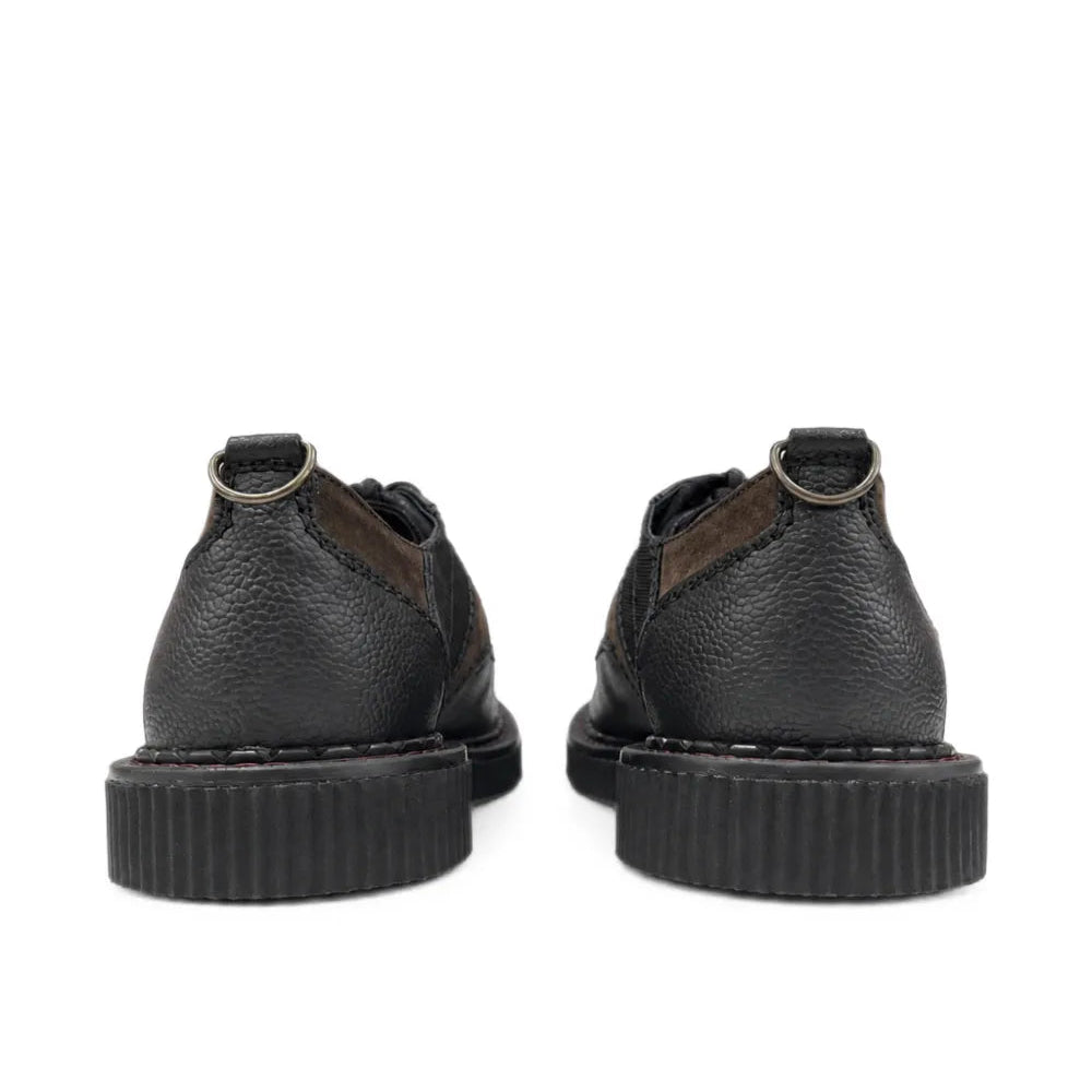 Back view of the pair, showing the pebble-grain leather heels, the metal D-rings and the ribbed platform soles.