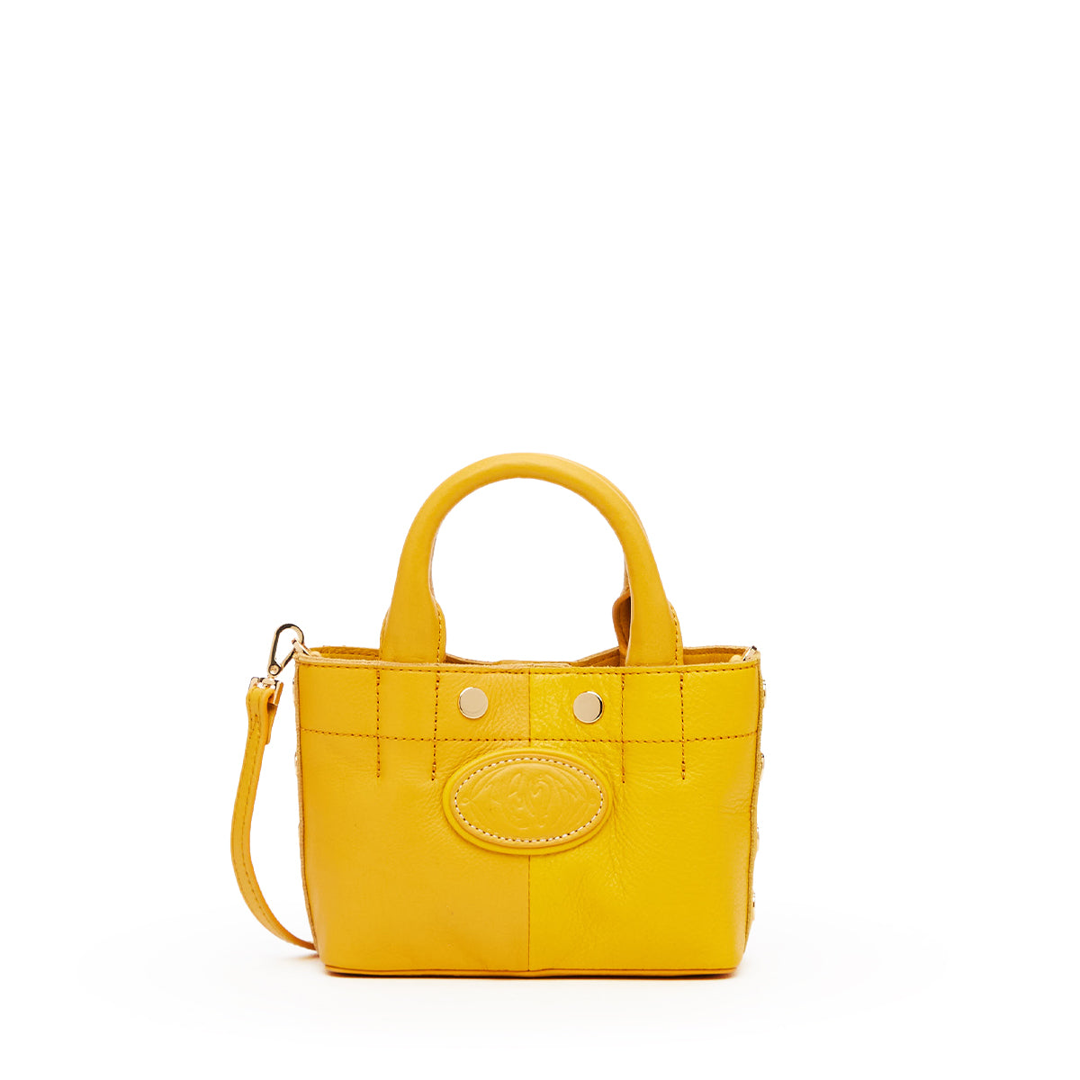 A bright yellow leather handbag with double top handles, a detachable shoulder strap, and a circular embossed logo patch on the front, shown against a plain white background.