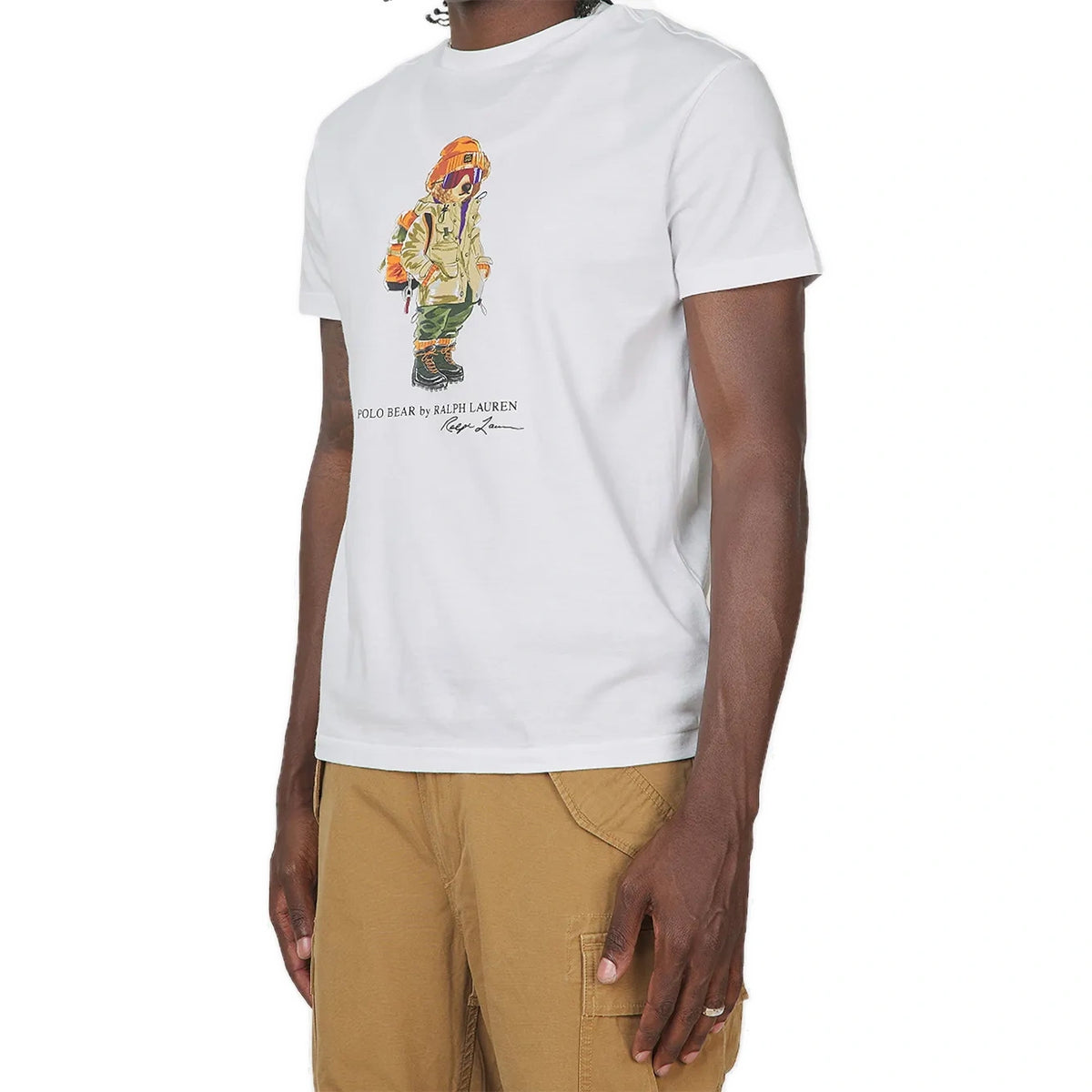 A model wears the white Polo Bear Jersey T-Shirt with tan cargo pants, seen from a three-quarter angle.