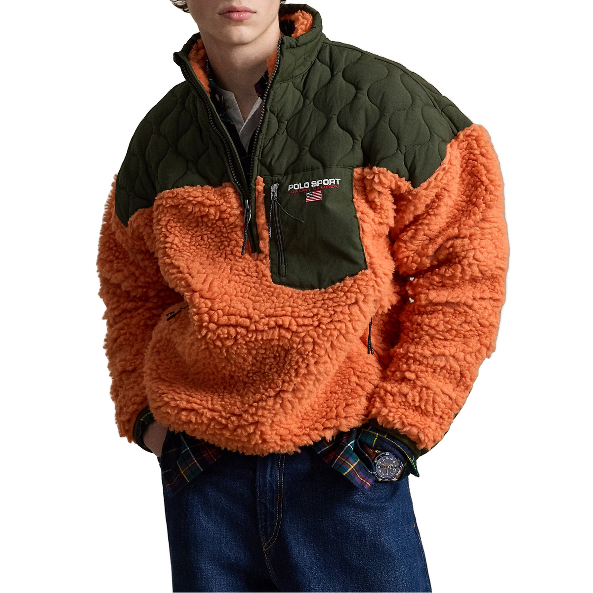 A model wears the orange and olive Polo Sport Pullover with dark jeans, hands in his pockets.