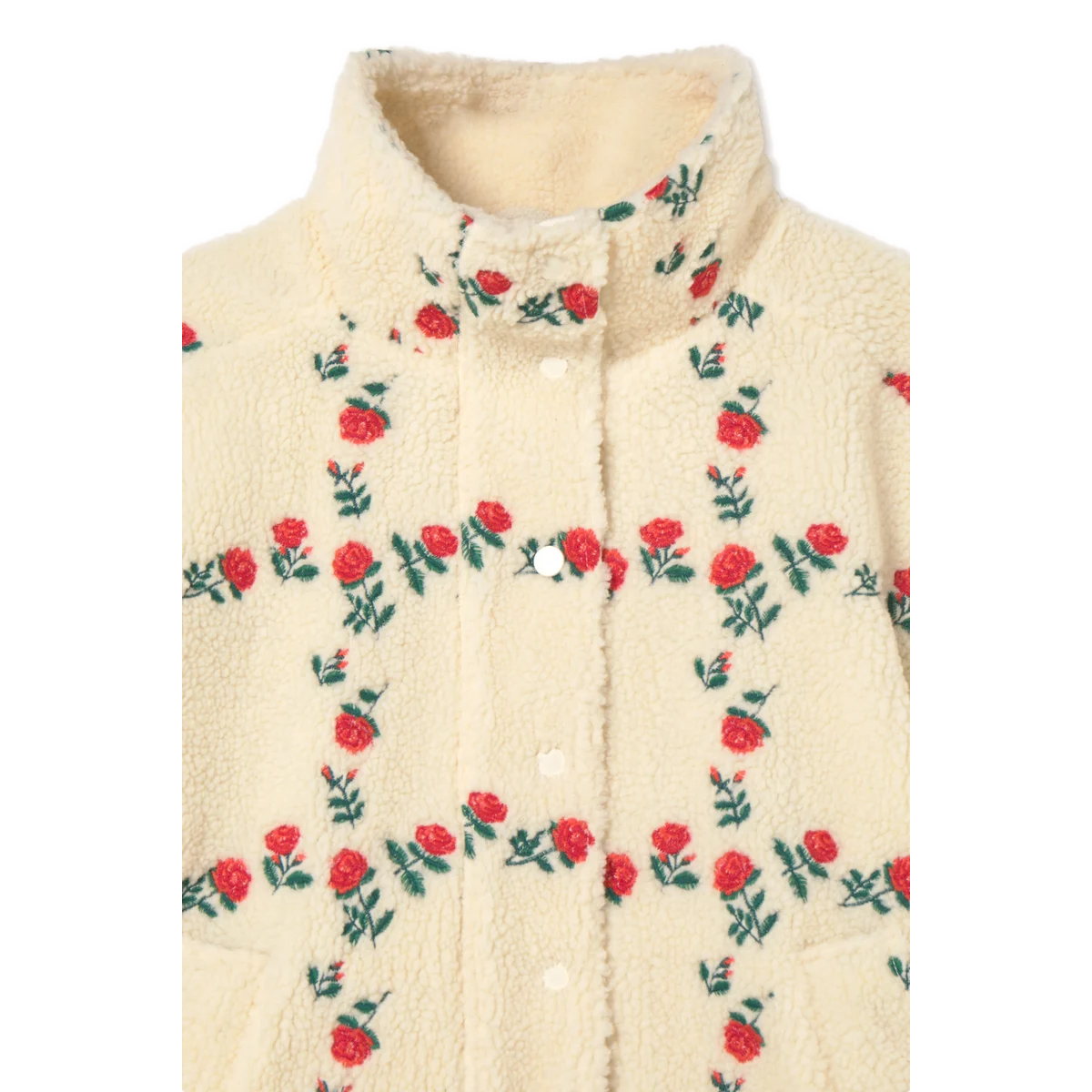 Close-up of the high collar on The Tiny Big Sister Roses Grid Sherpa Jacket, showing the textured cream sherpa, embroidered red roses, and tonal snaps.
