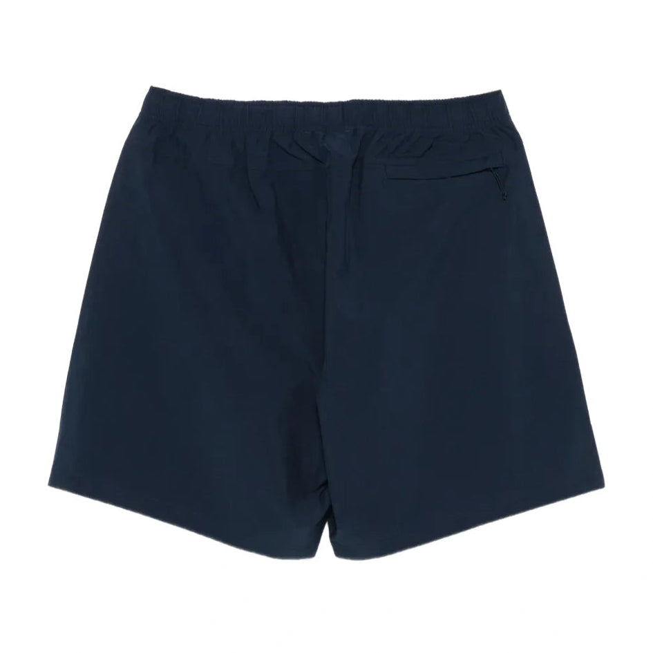 Back view of the navy Sport Short laid flat, showing the elastic waistband and a zippered back pocket.