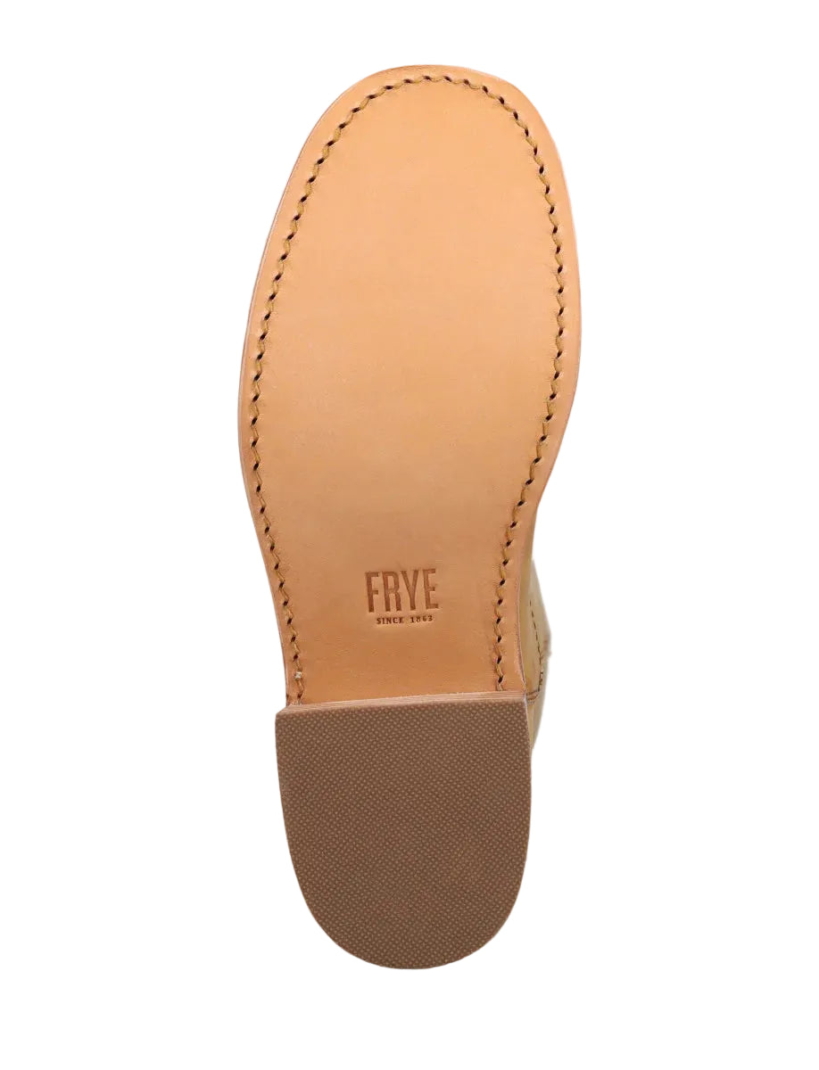 Close-up of a tan leather boot sole with 'Frye' branding on a white background
