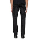 Person wearing black pants on a white background