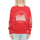 Person wearing a red sweatshirt with 'Rosewood Symphony Orchestra' design on a white background
