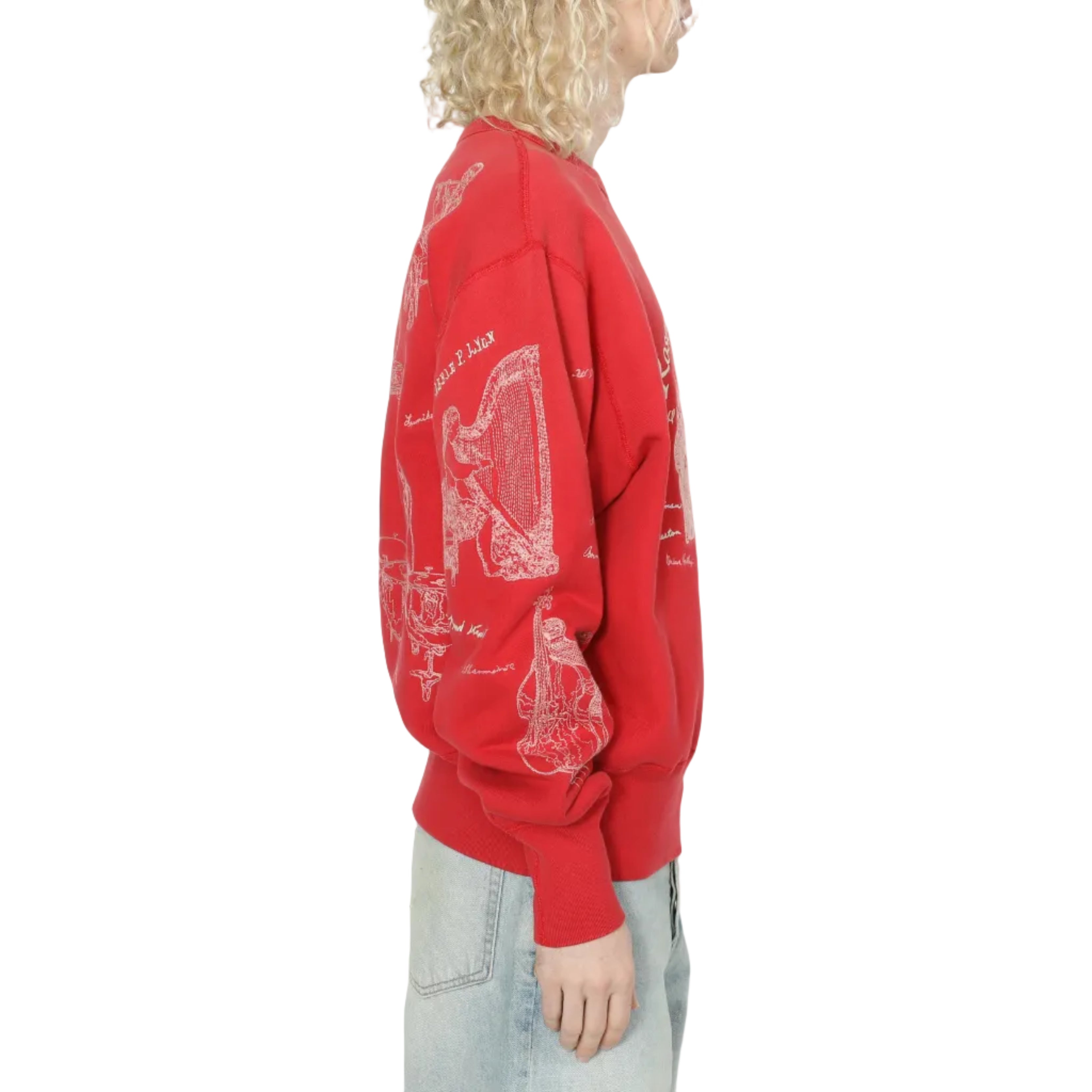 Person wearing a red sweatshirt with white graphics on a plain background
