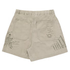 Beige shorts with embroidered designs on a white background