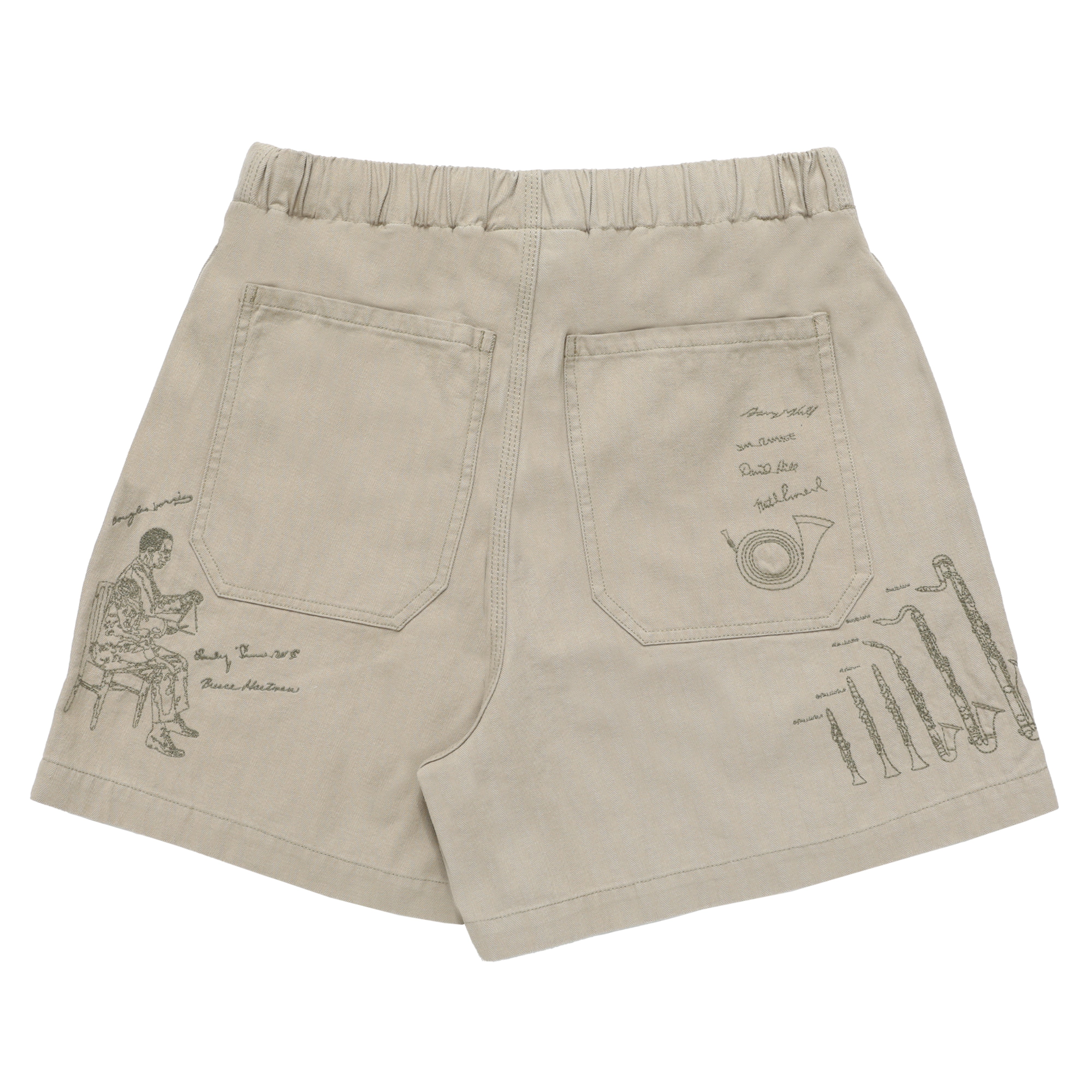 Beige shorts with embroidered designs on a white background