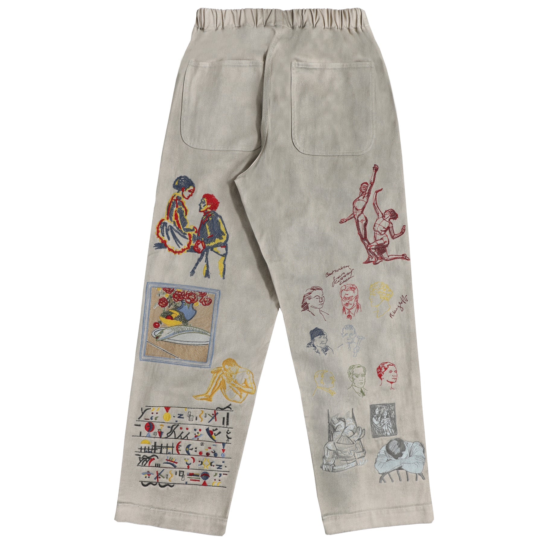 Beige pants with colorful embroidered designs on a white background