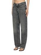 Person wearing gray high-waisted jeans on a white background