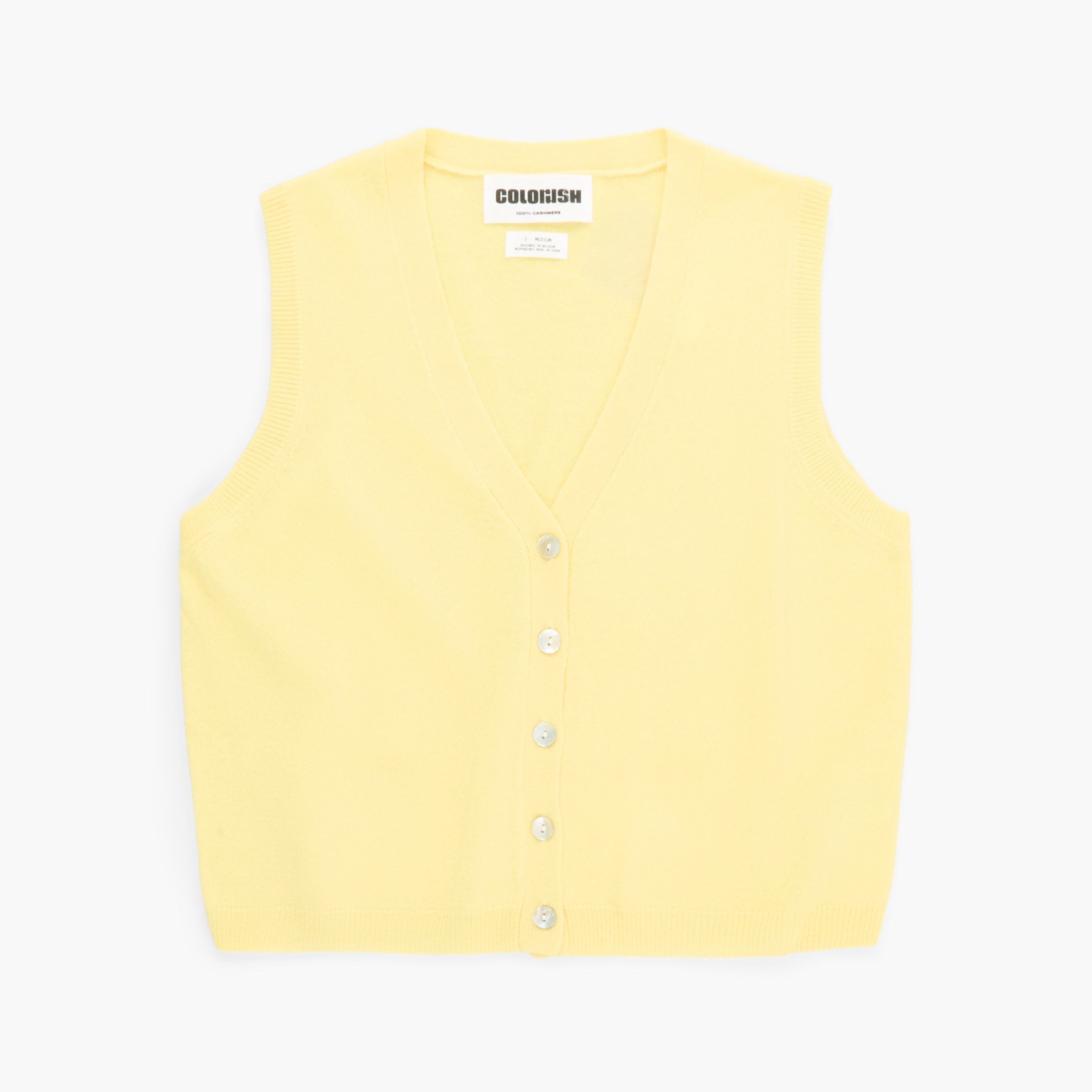 Yellow vest with buttons on a white background