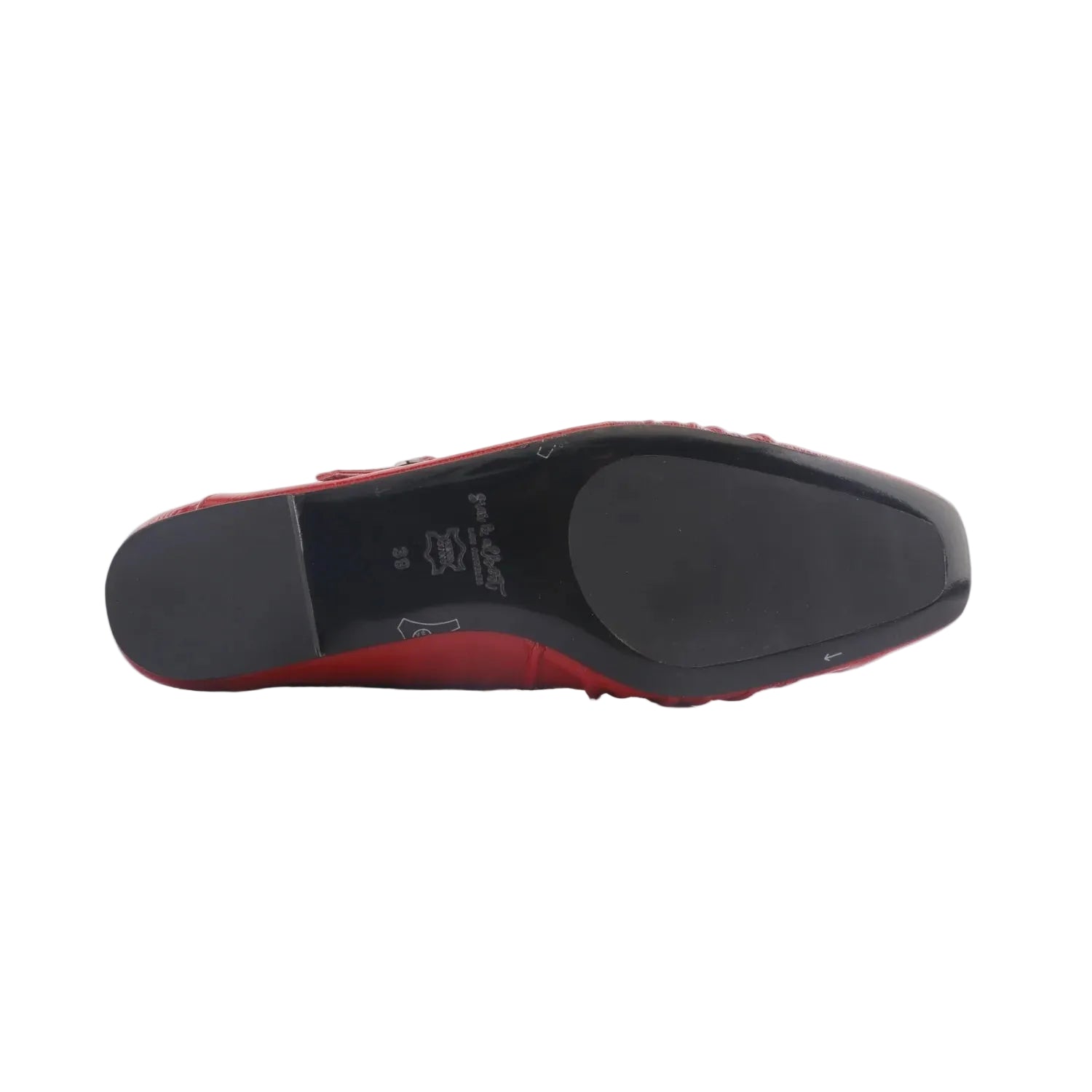 black rubber sole of red shoes on a white background