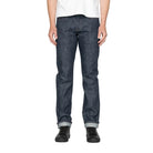 model in blue jeans on a white background