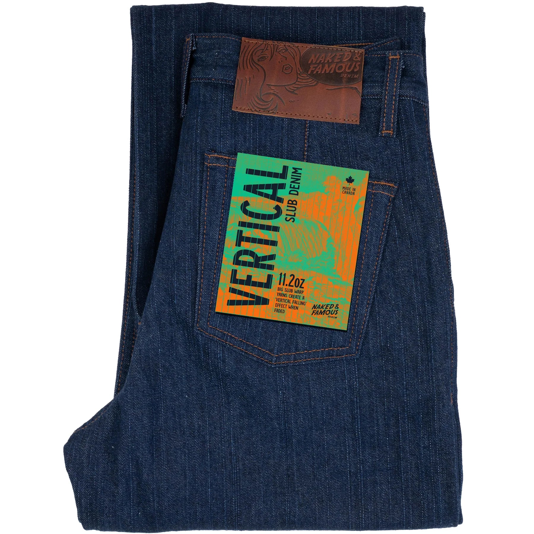 Folded blue denim jeans with a brand label on a white background