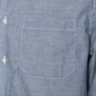 Close-up of a blue striped shirt with a pocket