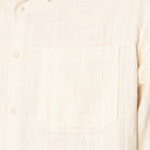 Close-up of a beige fabric texture