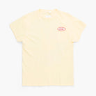 Beige t-shirt with a small red logo on a white background