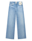 Wide leg blue jeans on a white background