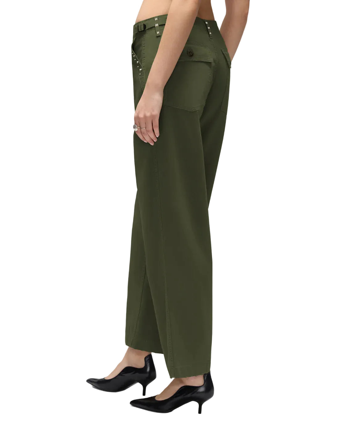 Model in army green military style pants on a white background