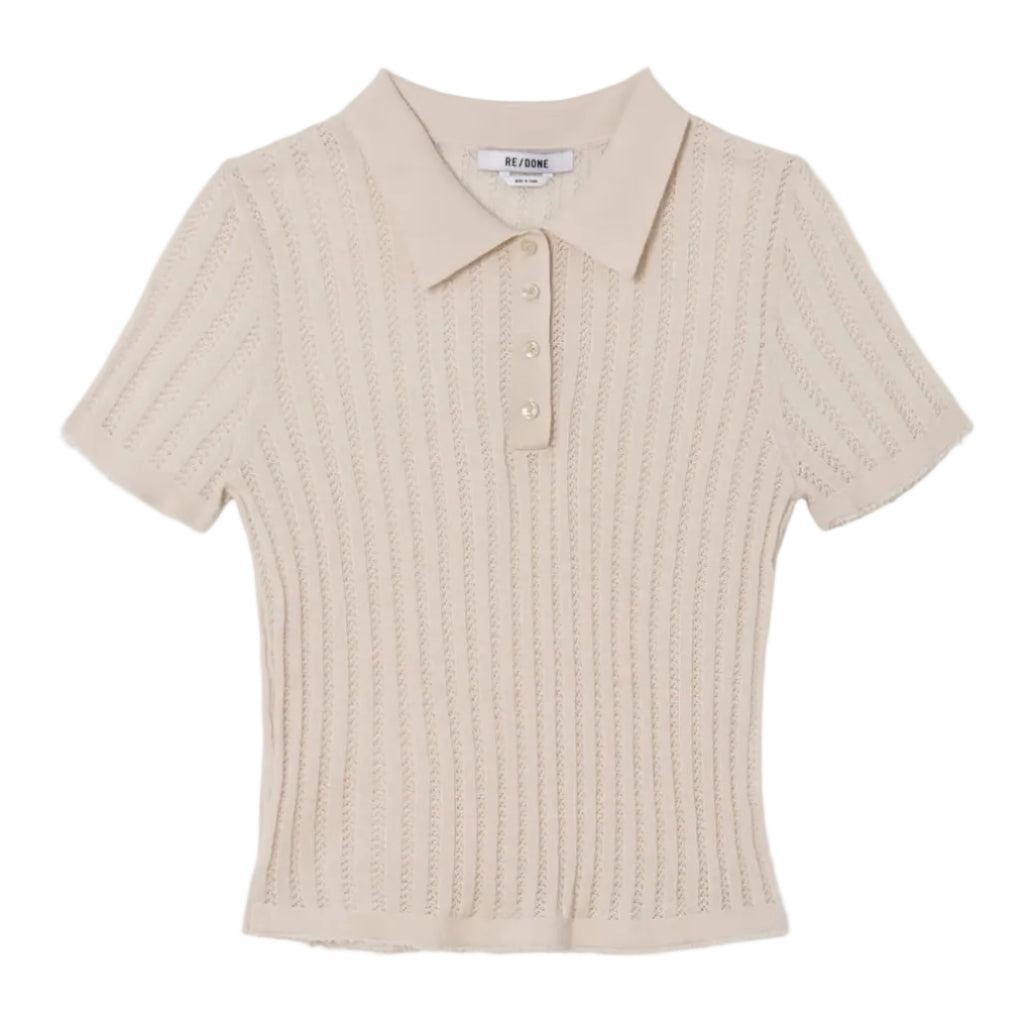 Ivory knit polo on a white background