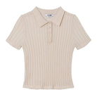 Ivory knit polo on a white background