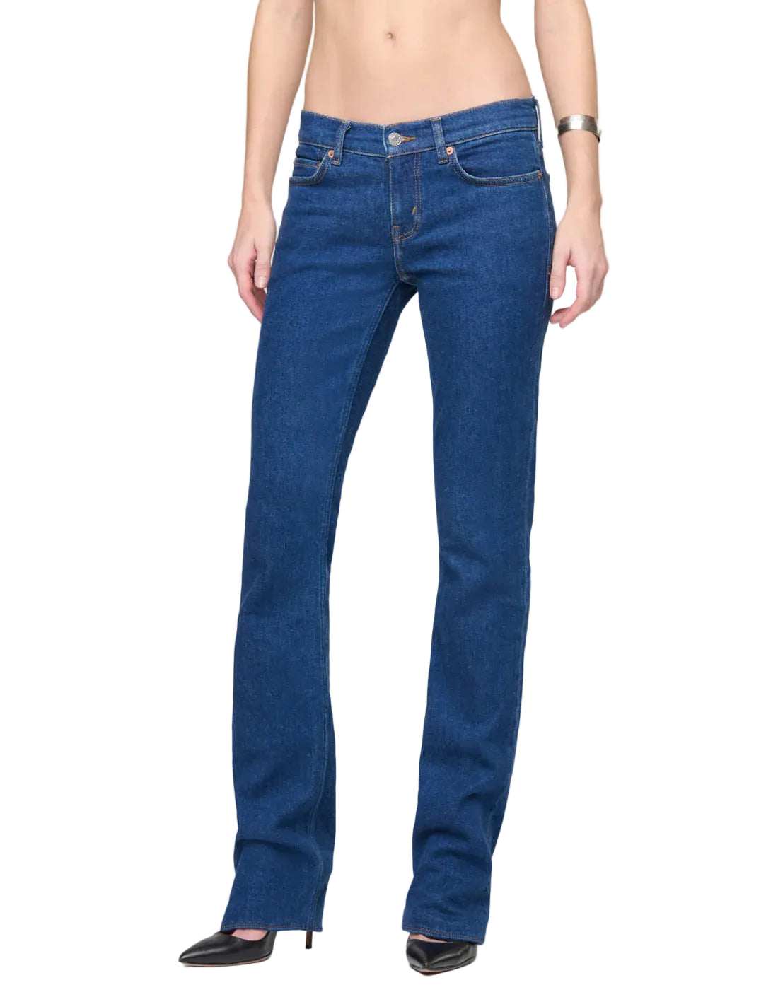 Person wearing blue jeans on a white background