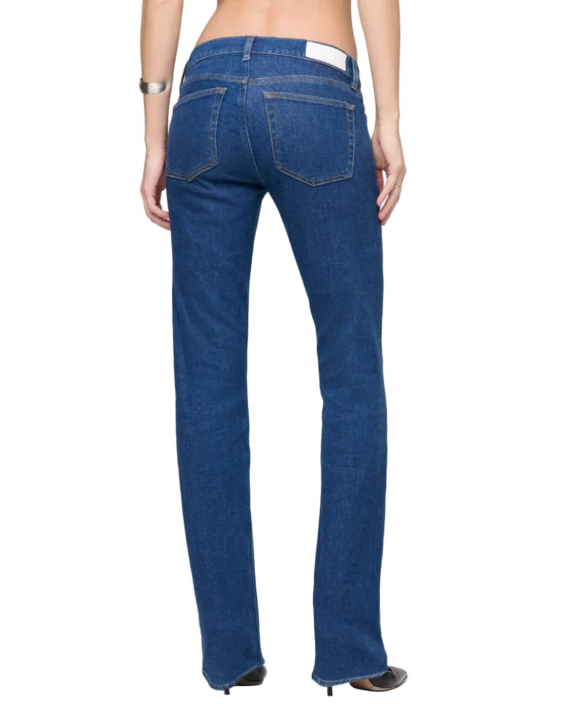 Blue jeans worn by a person on a white background