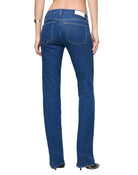 Blue jeans worn by a person on a white background