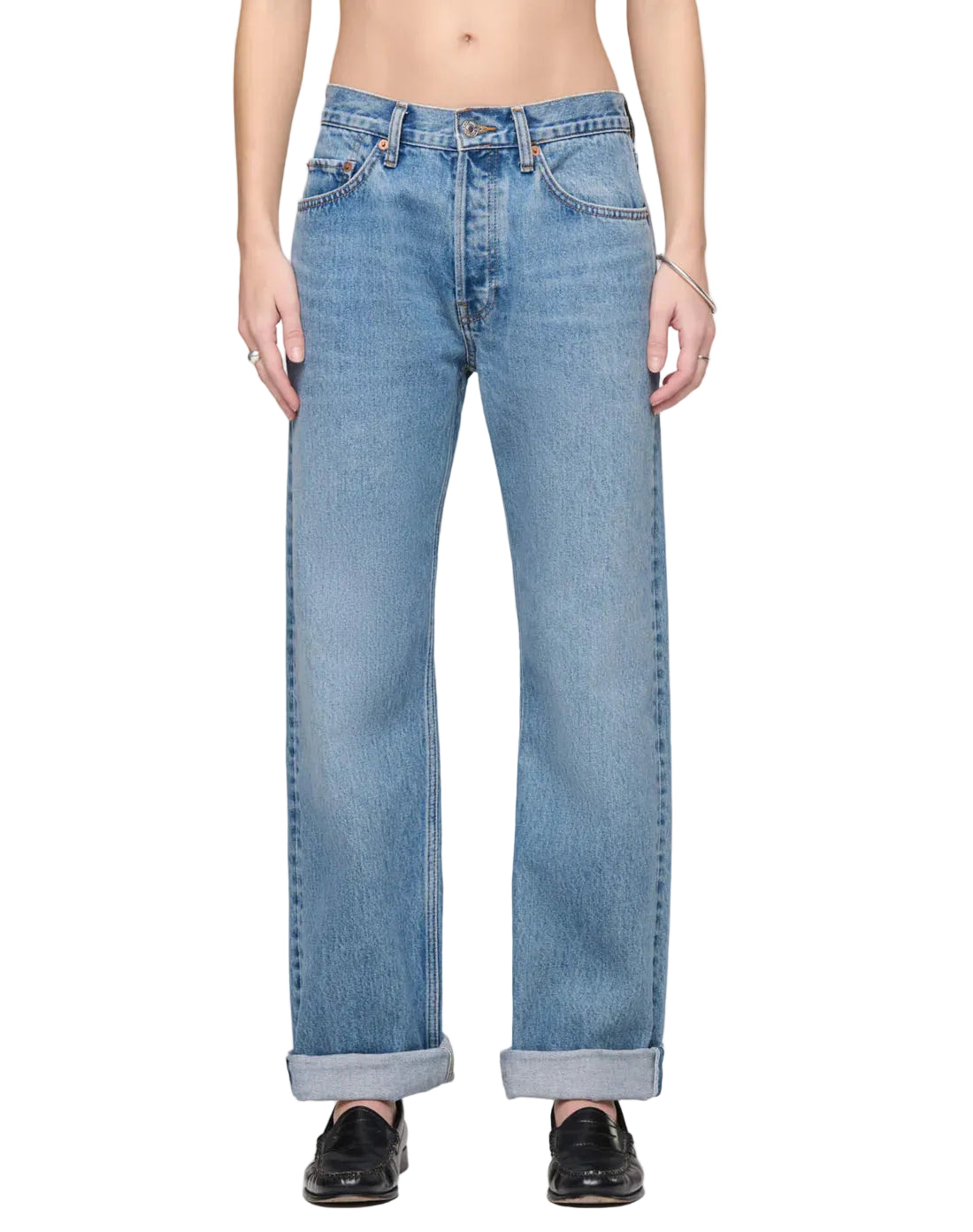 Person in blue jeans on a white background