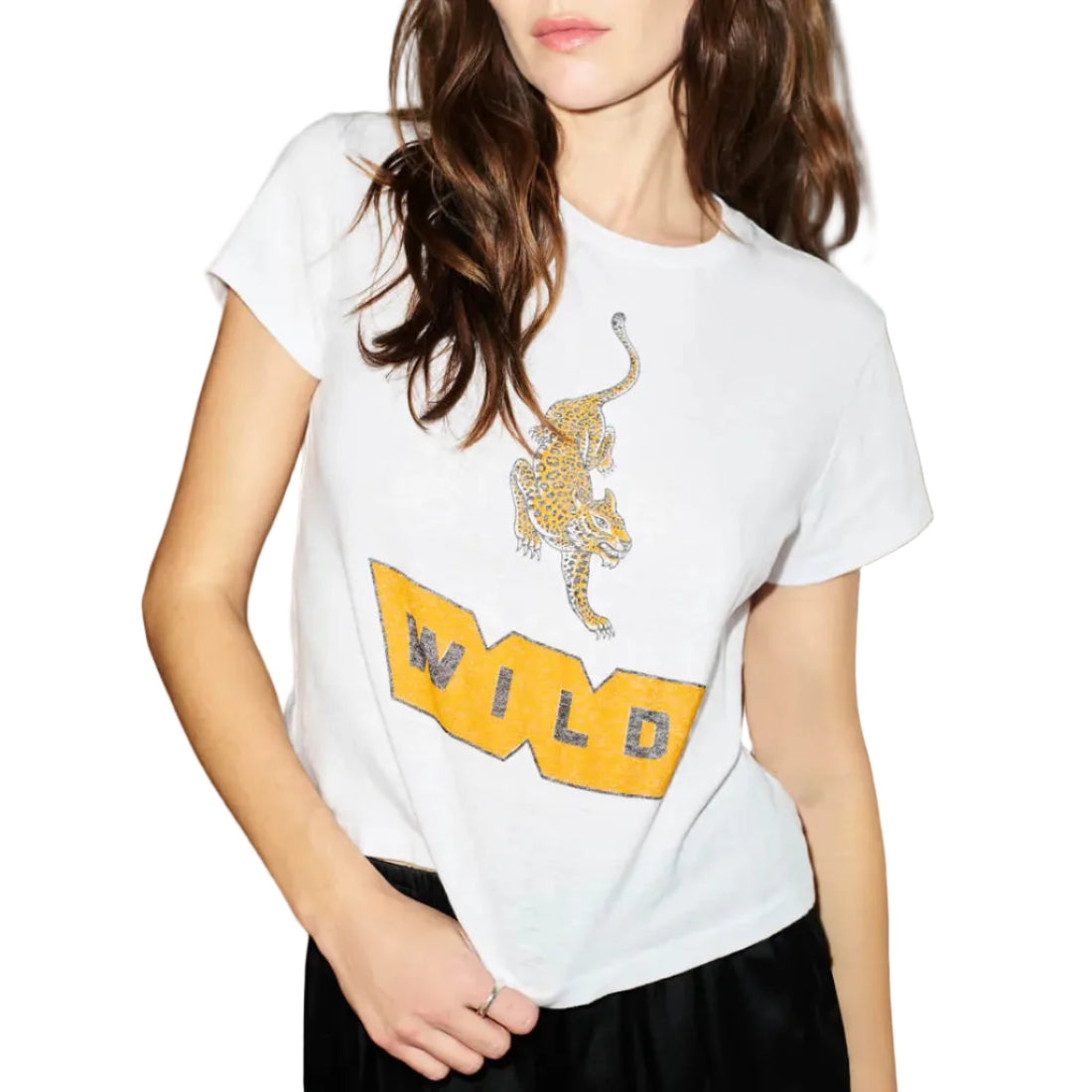 Person wearing a white t-shirt with a graphic design against a plain background