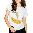 Person wearing a white t-shirt with a graphic design against a plain background