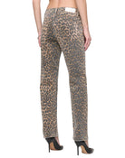 Leopard print jeans worn by a person on a white background