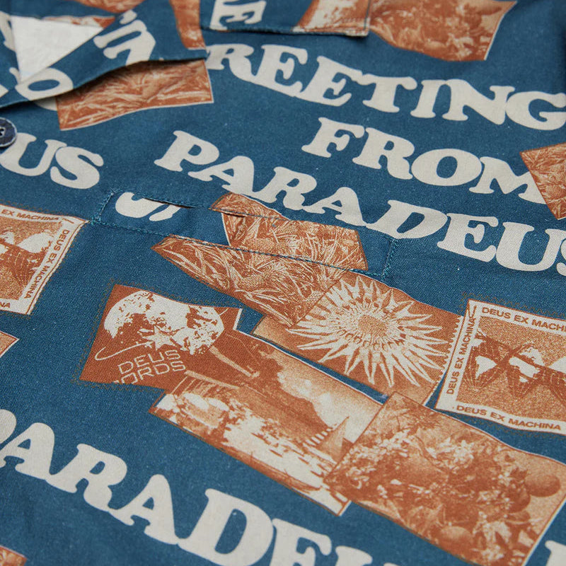 Close-up of a shirt with vintage-style graphics and text on a blue background