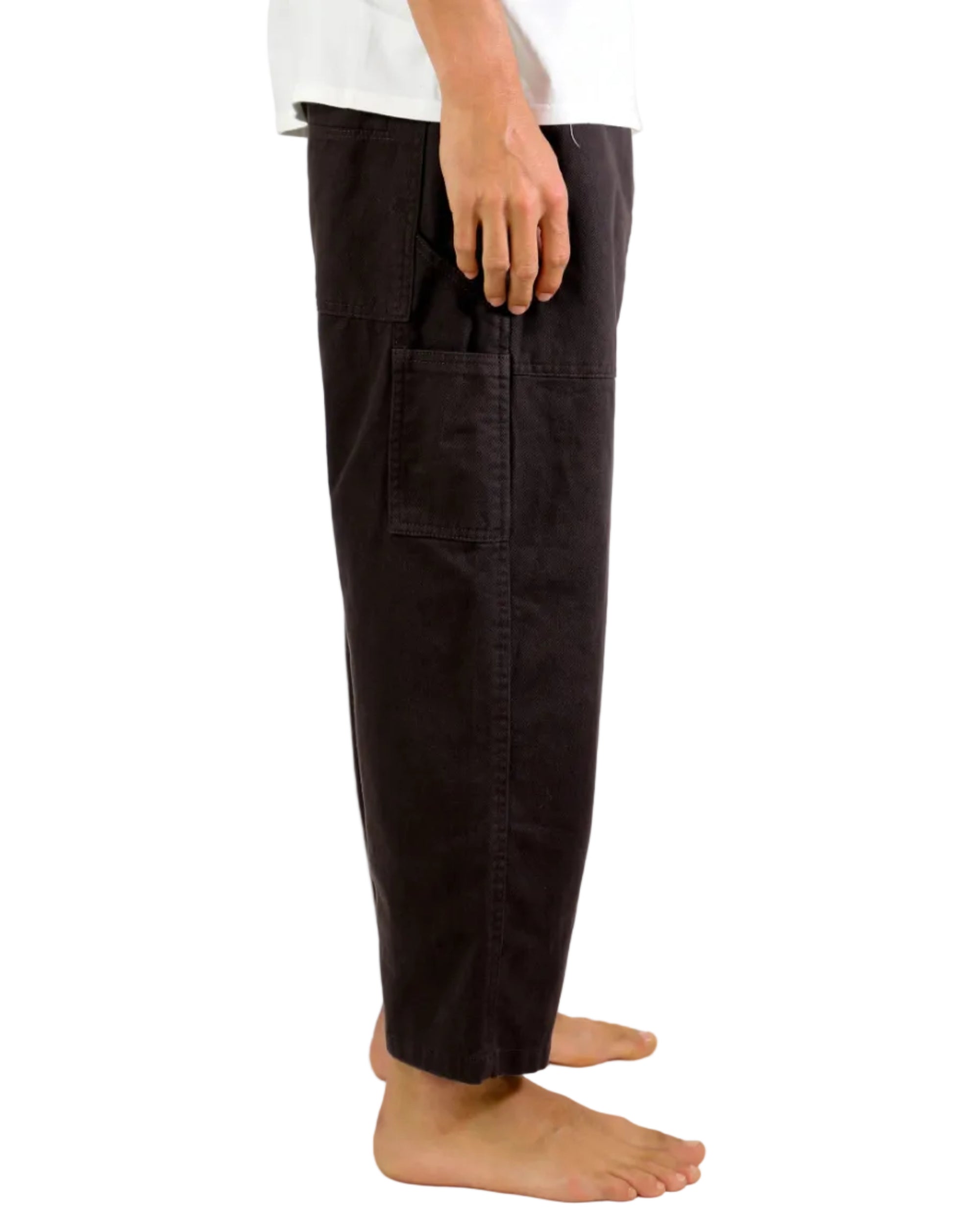 Person wearing dark pants on a white background