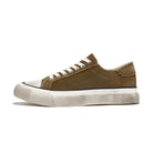 Brown sneaker with white sole on a white background
