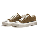 Brown sneakers with white soles on a white background