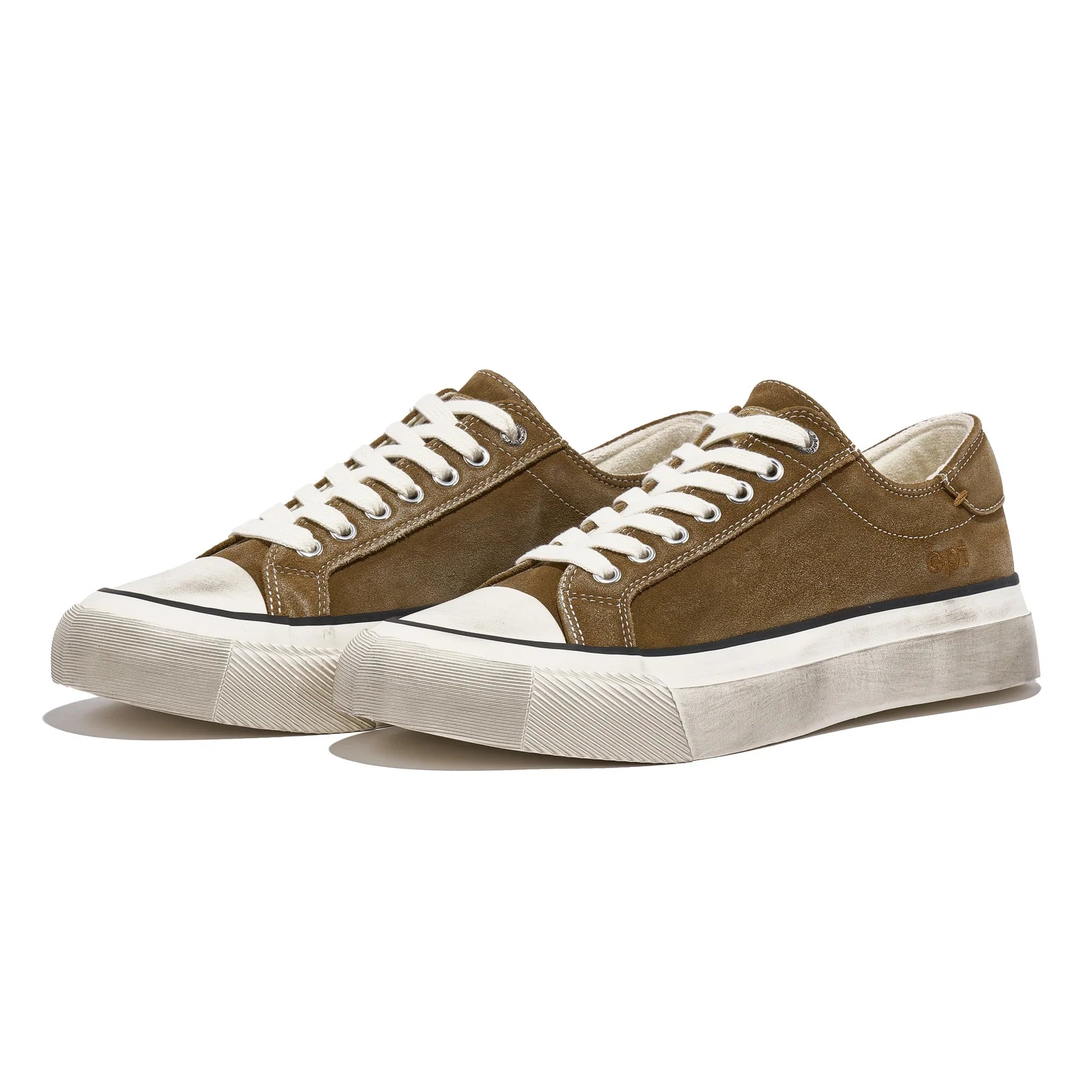 Brown sneakers with white soles on a white background