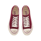 Pair of red sneakers with white laces on a white background