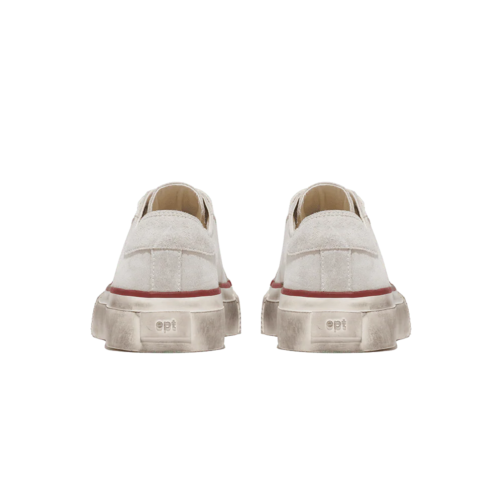 Pair of white sneakers with red accents on a transparent background