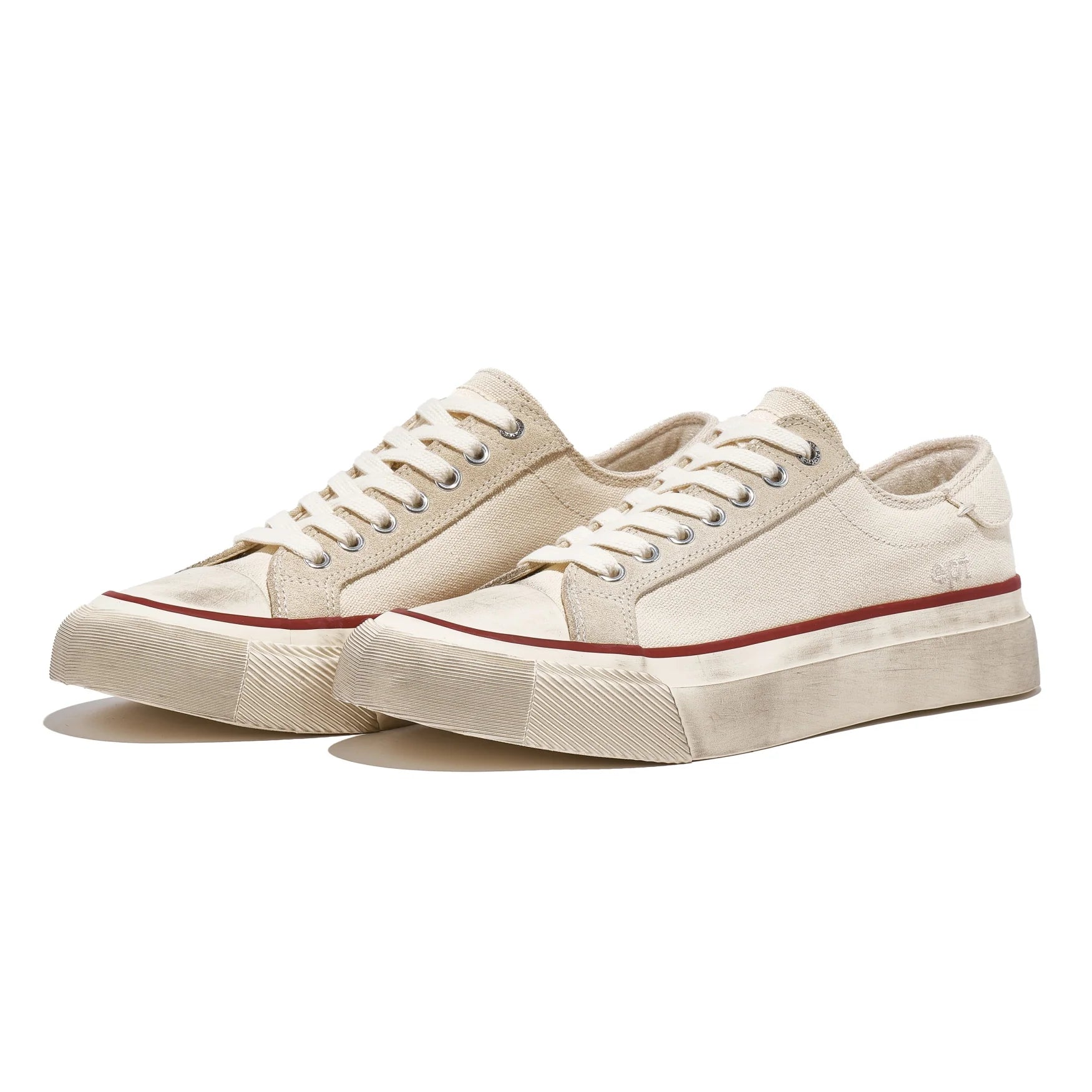 Pair of beige sneakers with red accents on a white background