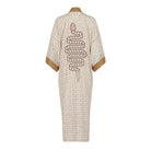 Beige robe with snake design on a white background