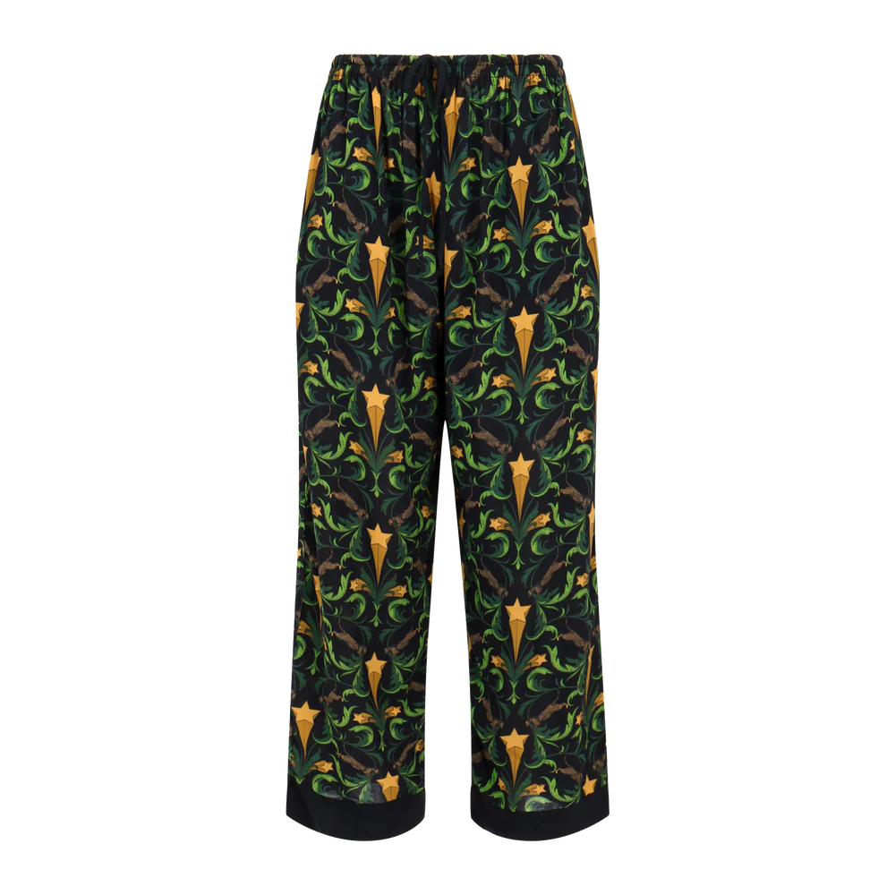 Lounge pants with a pattern of stars and leaves on a white background
