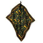 Decorative bandana with green and yellow pattern on a white background