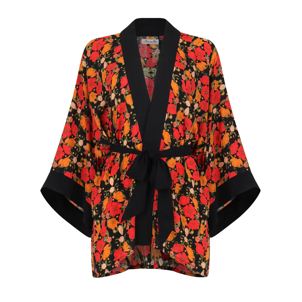Floral patterned kimono jacket with a black belt on a white background