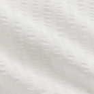 Close-up of a textured white surface