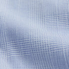 Close-up of textured light blue fabric with a subtle pattern