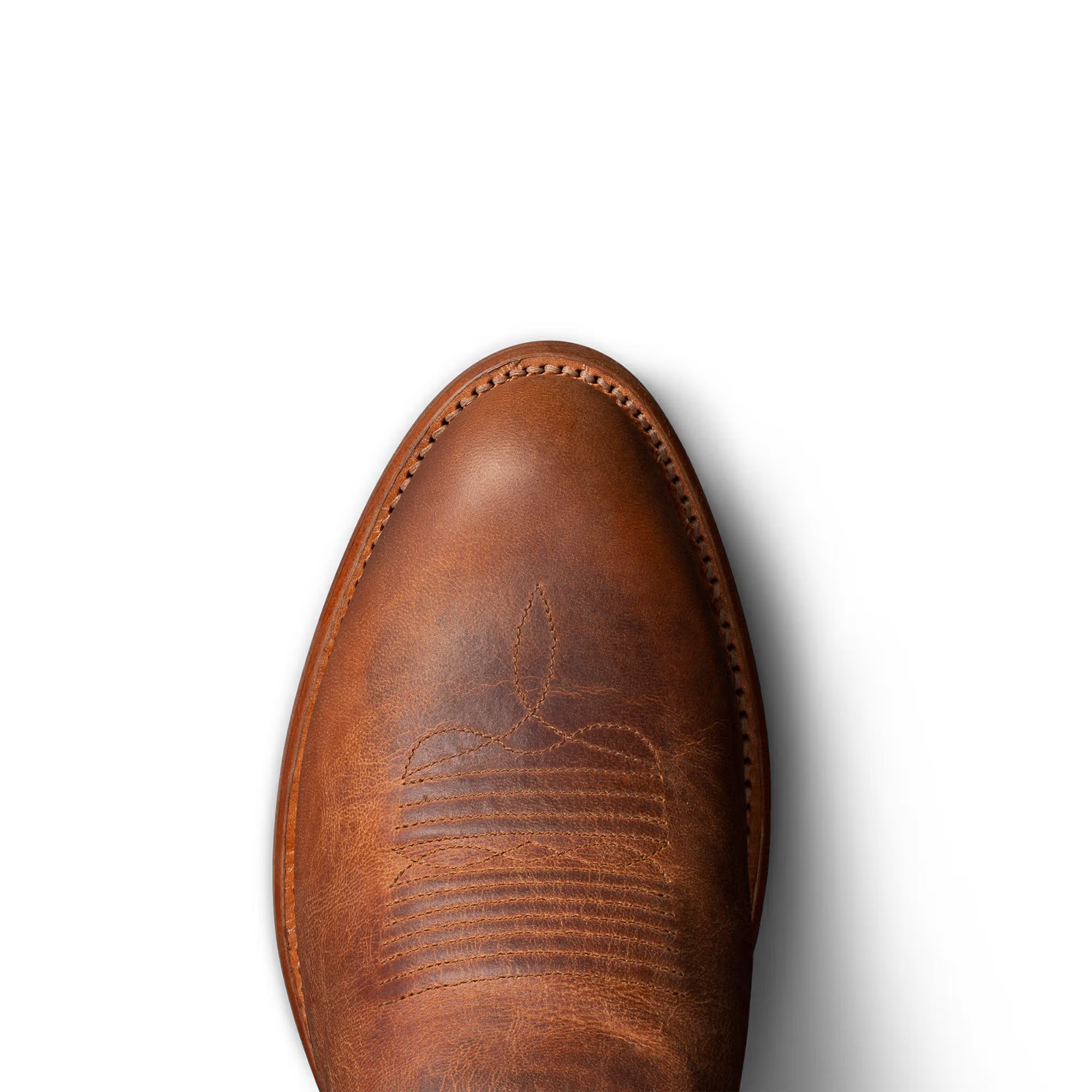 top view of brown cowboy boots on a white background