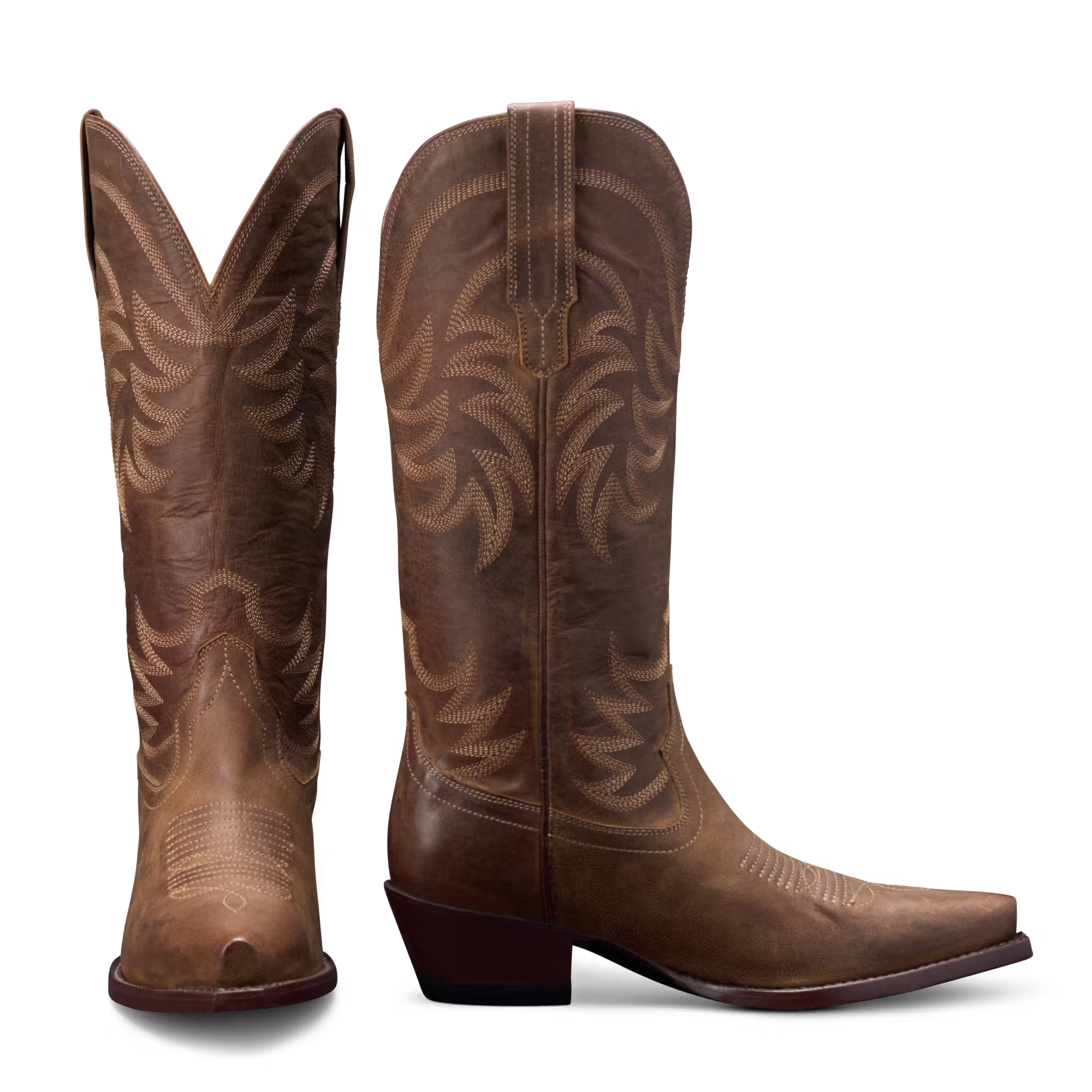 Pair of brown cowboy boots with intricate designs on a white background