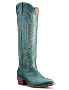 Teal cowboy boot with intricate designs on a white background